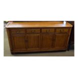 Modern Chinese hardwood sideboard, fitted with four drawers over four cupboard doors, flanked either