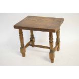 Good quality elm rectangular hard topped stool on four turned legs, supported by an 'H' stretcher,