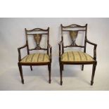 Edwardian mahogany his and hers armchairs, with Ivorine inlaid shield back and ivory stringing