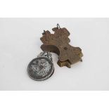 Two reproduction cast metal wall mounted note clips with cast design, together with a further