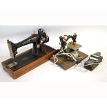 Singer sewing machine model number EB371665, together with a further small vintage sewing machine