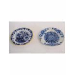 Two Dutch blue and white printed Delft plates, one with a yellow rim with blue floral printed