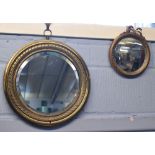 Pressed brass circular mirror, with a bevelled glass (missing sconce), together with a further resin