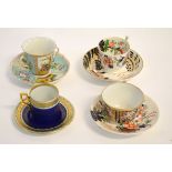 Group of four 19th century cups and saucers to include a Crown Derby cup with gilded and stylised
