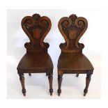 Pair of Victorian oak hall chairs with carved scrolling back, supported on turned front legs (2)