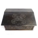 Early 18th century oak Bible box with lift up lid fitted with three drawers with carved front,