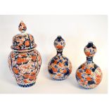 Pair of double gourd Imari decorated vases, in typical colours (a/f), together with a further