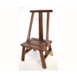 Eastern softwood stained child's chair with panelled seat and bar back on splayed legs, 42cms wide x