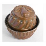Two vintage copper jelly moulds, 10 and 12cms high