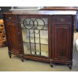 19th century mahogany bow fronted sideboard fitted with central glazed door with carved detail,