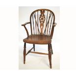 Late 18th century ash and elm stick back wheel back armchair on turned supports on an 'H' stretcher