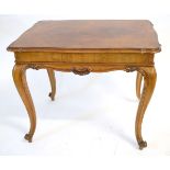 French walnut rectangular occasional table with a carved frieze, supported on four cabriole legs,