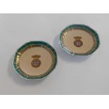 Pair of Samson armorial decorated plates, with a puce ground and a green and gilded border, 22cms