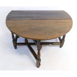 Late 17th or early 18th century oak drop leaf gate leg table on turned supports with single drawer