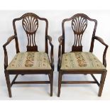 Pair of Georgian mahogany pierced splat back armchairs with floral embroidered seats on tapering