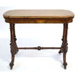 Victorian walnut oval inlaid fold-over card table with red baize lined interior, supported on four