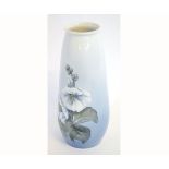 Royal Copenhagen tapering vase decorated with large white flower heads against a light blue