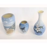 Royal Copenhagen baluster vase decorated with coastal scene, further butterfly decorated vase and