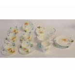 Shelley part tea set with orange and yellow floral design, comprising five cups and six saucers,