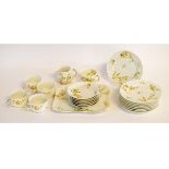 Limoges Haviland & Co part tea wares with yellow printed flowers, comprising five tea cups and six