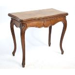 19th century French mahogany folder-over card table with green baize lined interior, supported on