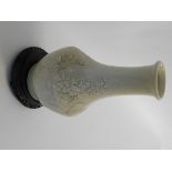 Oriental white crackle glaze vase with raised floral relief on a pierced and ebonised circular socle