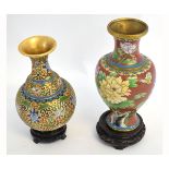 Two modern cloisonne vases, one with a gilt ground and swirled and floral design on an ebonised