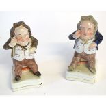 Two 19th century Staffordshire figures of political seated portly gentlemen, one in a blue overcoat,