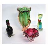 Four pieces of Studio glasswares to include a green and puce fluted vase of heavy form, together