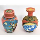 Two boxed ceramic spirit holders, of bulbous form, with raised and painted detail with ringlet