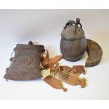 Mixed Lot: three various African carved wooden food containers, the first of crescent form, the