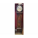 Mid-20th century oak cased floor standing triple barrel clock, the arched hood to a moulded throat