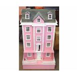 Large modern pink painted dolls house (constructed from kit), 116cms high together with a large