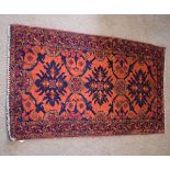 Small Caucasian rug, central three panel geometric design mainly rust field, 110cm x 55cm