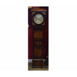 Mid-20th century oak cased floor standing clock, the square hood with stepped pediment and