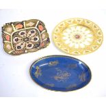 Wedgewood oval blue and gilded temple dog decorated plate, together with a further Royal Crown Derby