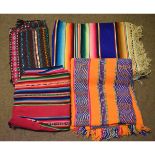 Five assorted South American woven multi-coloured wool coverings