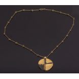Italian circular disc pendant and chain, circa 1970, an abstract design by Atelier des Orfeveres,