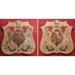 Pair of late Victorian painted and gilt highlighted pressed card on pine shield shape crests, each