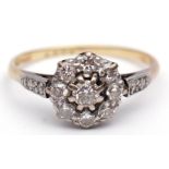 Precious metal diamond cluster ring, the principal diamond 0.15ct approx, raised within a surround