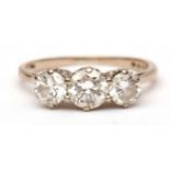 Diamond three-stone ring, the centre brilliant cut diamond 0.65ct approx with a further brilliant