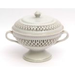 Chinese white glazed porcelain reticulated covered pot pourri with applied double loop handles and