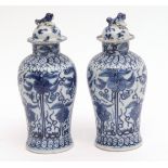 Pair of Chinese blue and white porcelain jar and covers decorated in Kangxi style with stylised