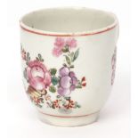 Lowestoft cup, circa 1780, with polychrome decoration including floral sprays and cornucopia, the