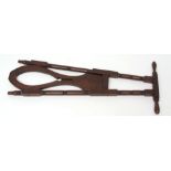 19th century mahogany bootjack with ring turned frame, 84cm long
