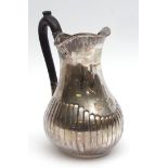 Victorian baluster jug, the half fluted oval baluster body with chased foliate border and