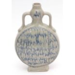Chinese studio porcelain moon flask with loop handles, covered in a thick pale celadon glaze with