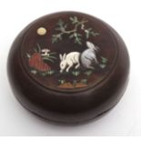 Chinese circular lacquered wood box and cover inlaid in mother of pearl and stained ivory, with