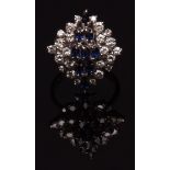 18ct white gold sapphire and diamond cluster ring, the tiered centre set with nine oval shaped