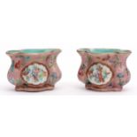 Rare pair of Chinese famille rose porcelain bird feeders with reserves of floral sprays against a